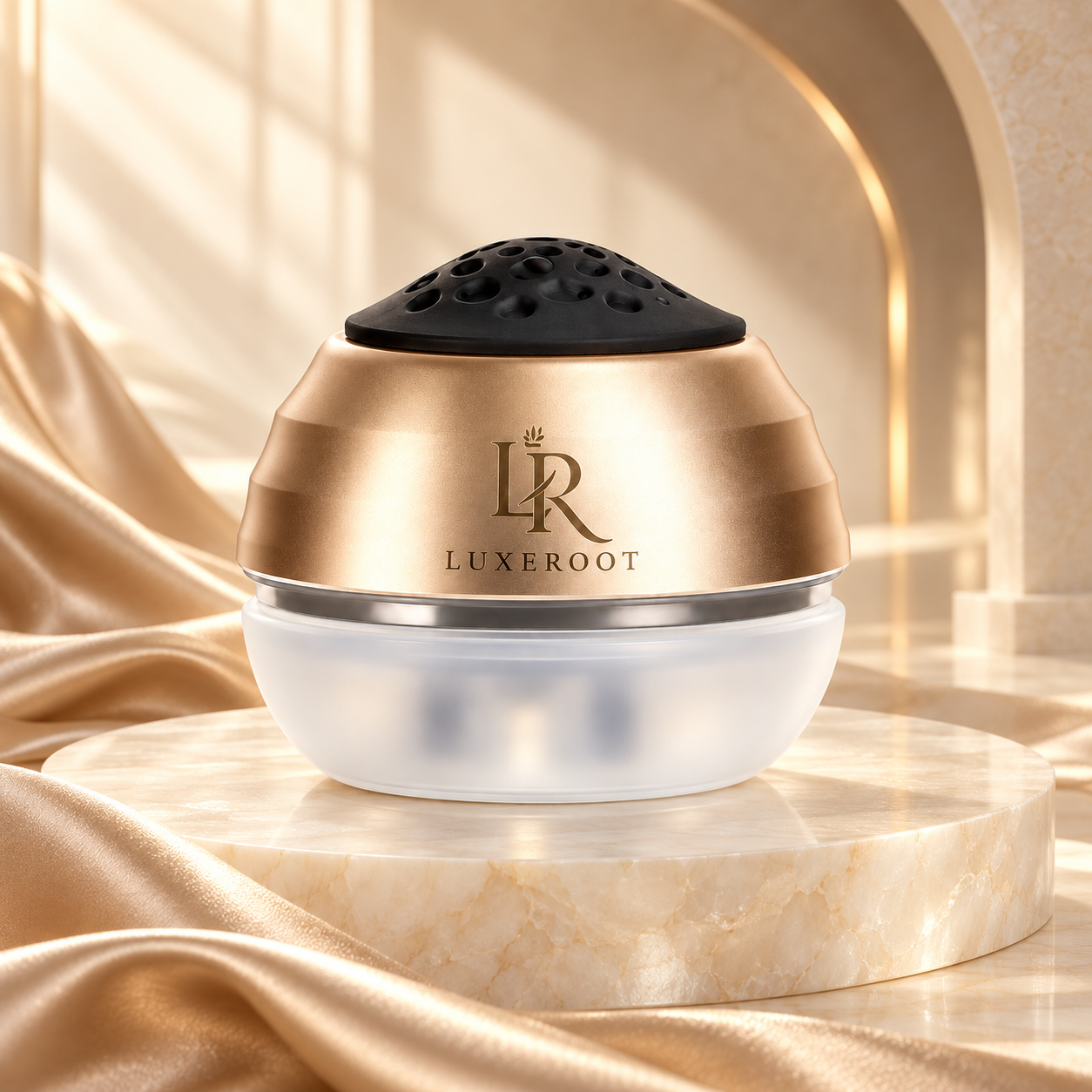 LUXEROOT scalp massage and serum applicator in champagne gold, on a stone pedestal
